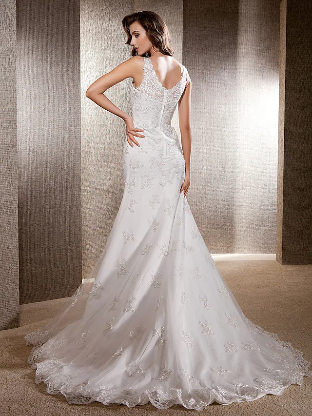 Full length view of a sleeveless mermaid trumpet bridal gown.