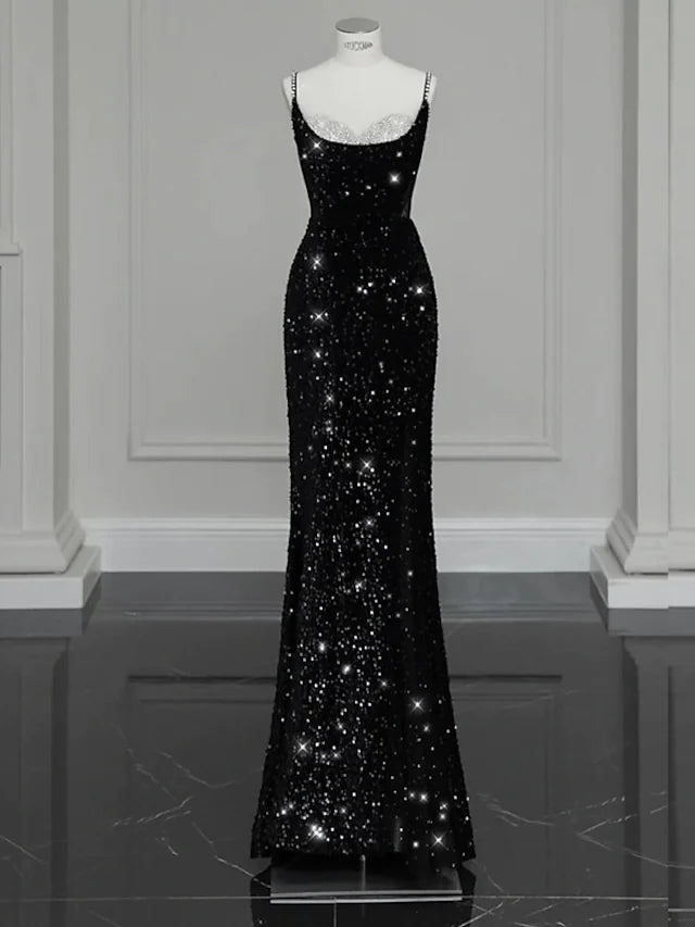 Elegant sequined Mermaid Trumpet evening gown with spaghetti straps.
