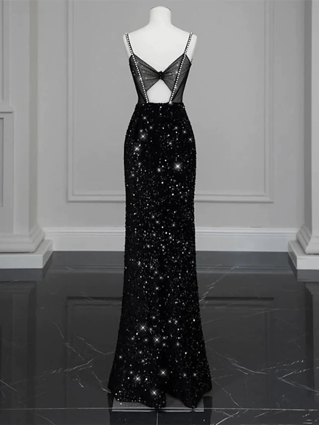 Back view of the floor-length formal dress, showcasing the bow detail.
