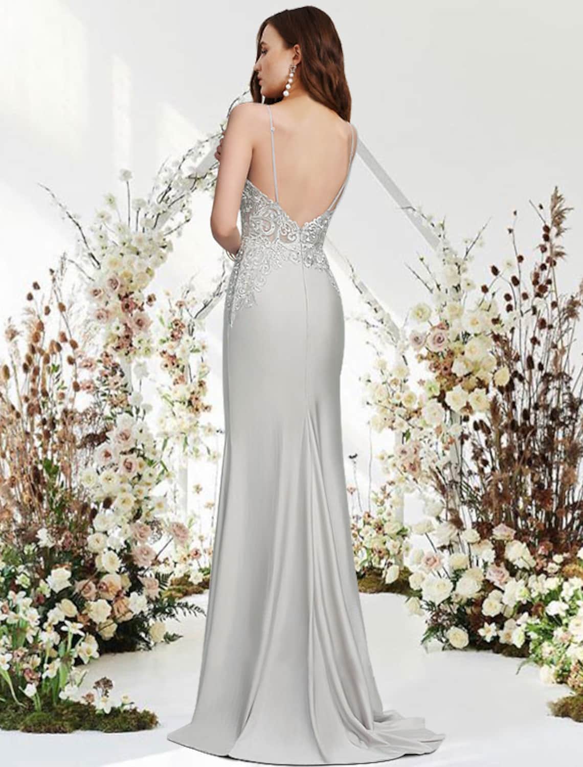Back view of the Mermaid Trumpet Evening Gown, showcasing the sweep train and intricate appliques.