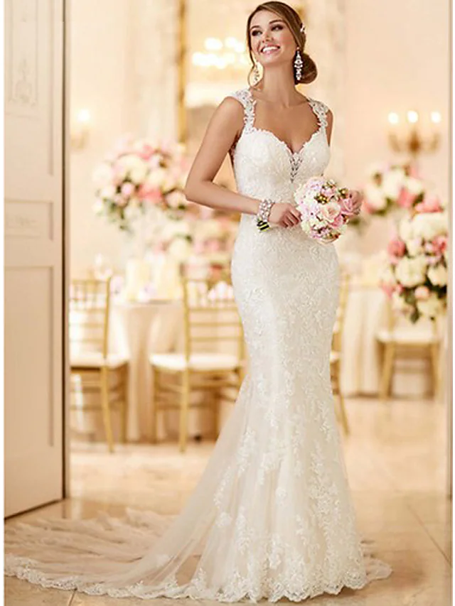 Elegant mermaid wedding dress with V-neck and spaghetti straps, front view.