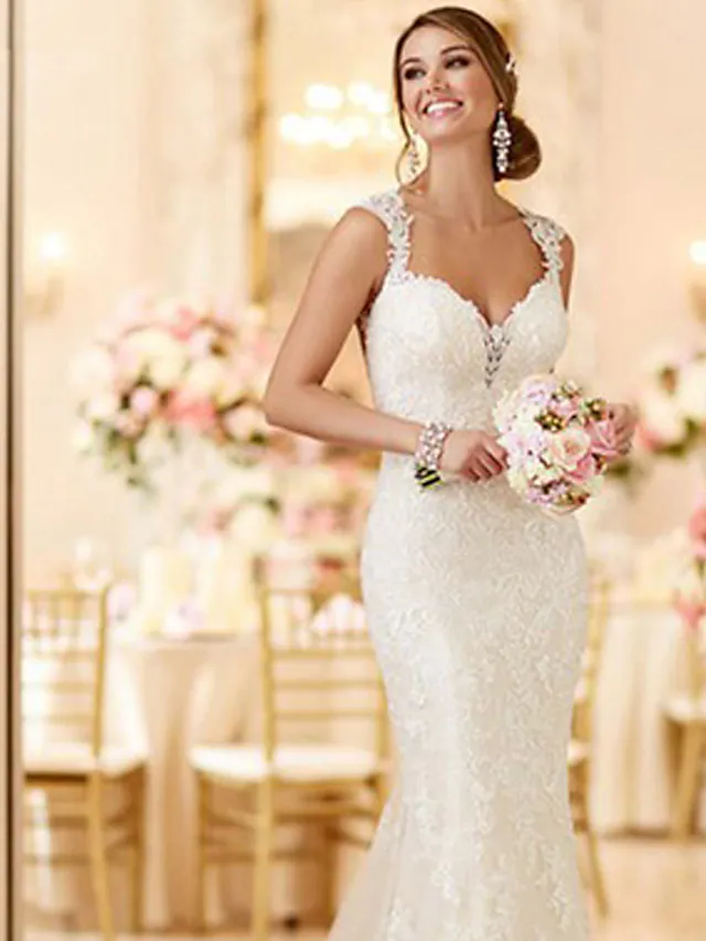 Side view of a mermaid wedding dress, showing the sweep train.