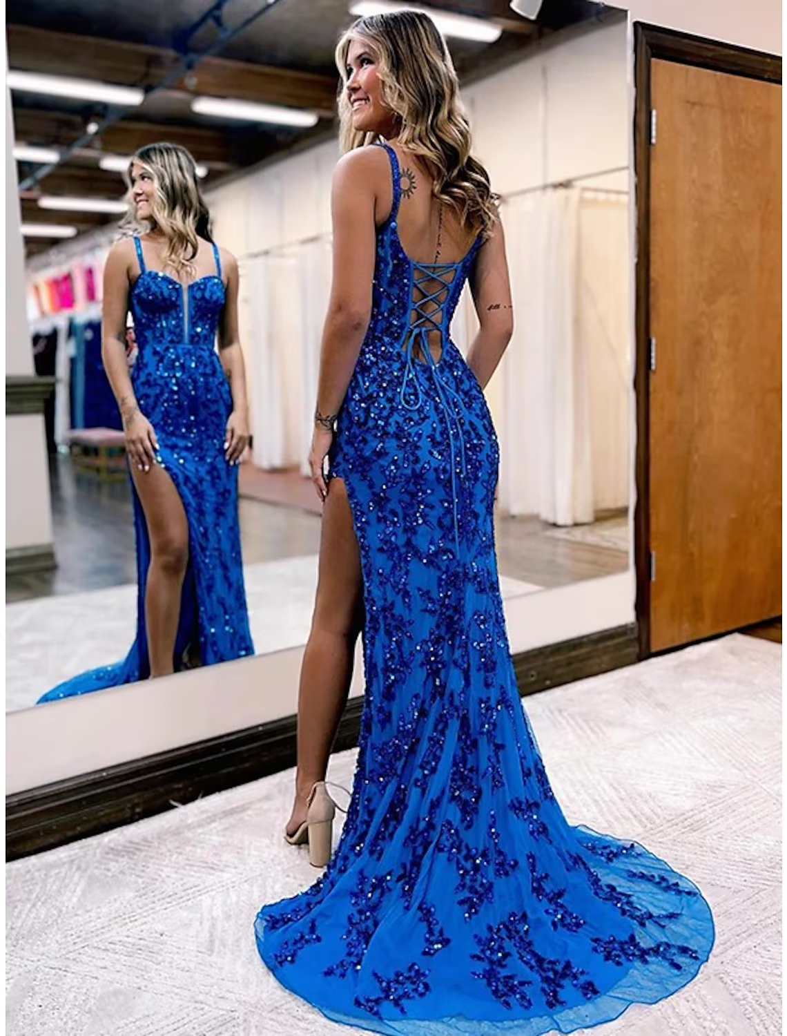 Back view of the Mermaid Trumpet gown, showcasing the open back design.