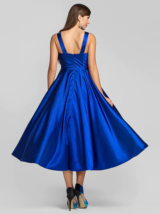 Side profile of minimalist square neck tea length dress.
