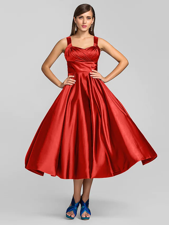 Close-up of square neckline and stretch satin fabric.