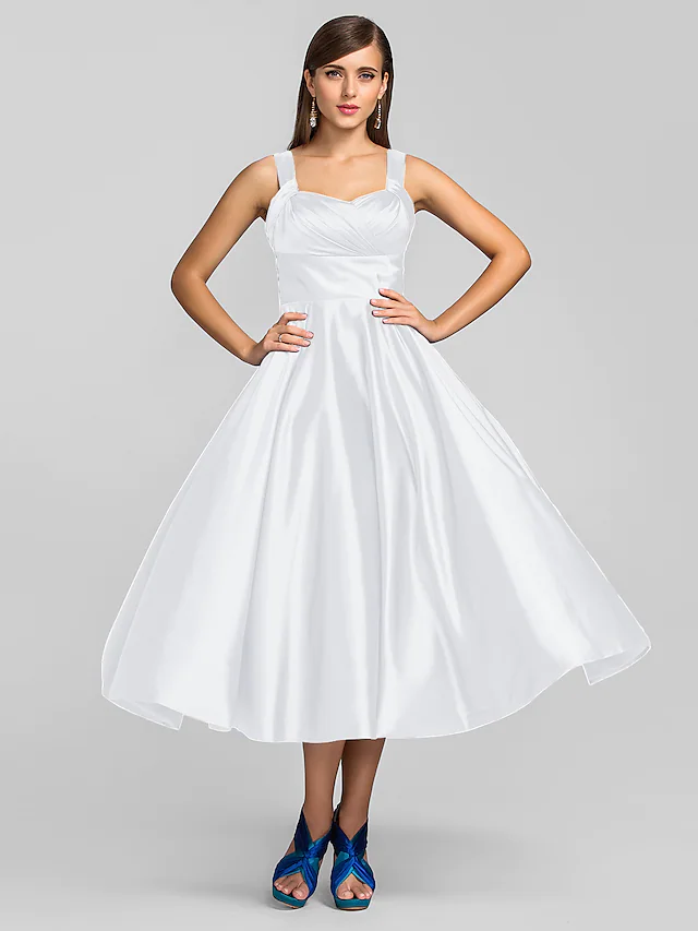 Full length view of elegant tea length dress.