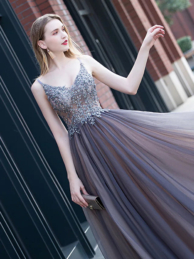 Back view of a minimalist floor-length prom gown.