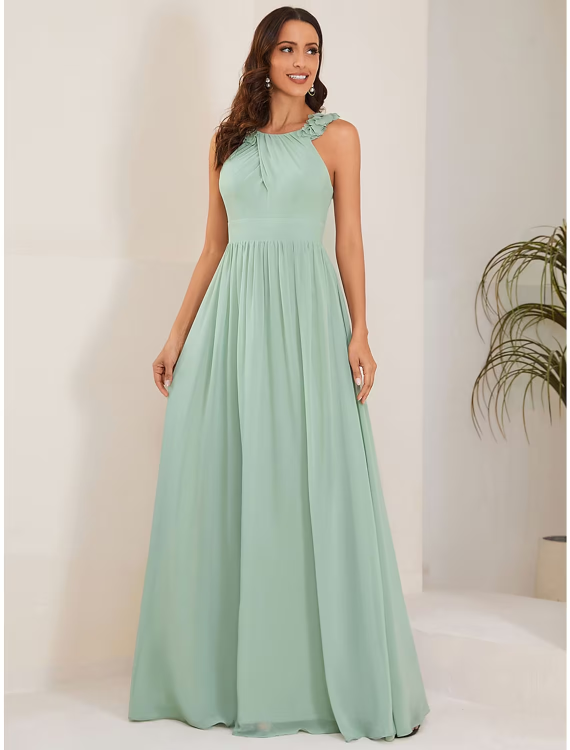 Elegant navy A-line chiffon floor length dress with jewel neck and shoulder flower.