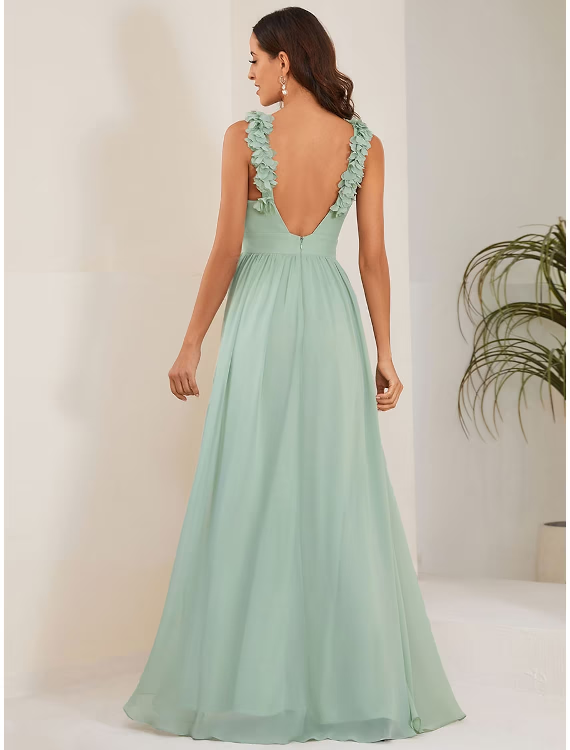 Navy A-line wedding guest dress showcasing the full floor length silhouette.