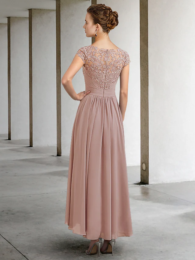 Side view of the elegant navy blue A-line gown, showcasing the flowing chiffon and delicate lace details.