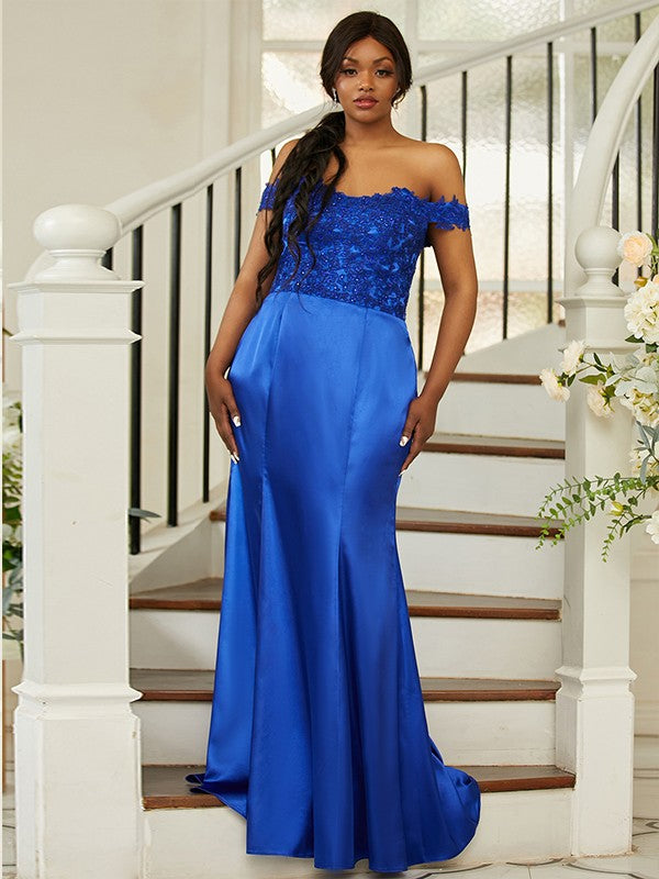 Elegant blue plus size bridesmaid dress with off-shoulder neckline and applique.