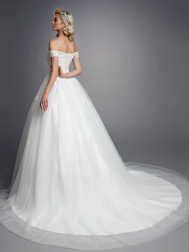 Back view of off-shoulder wedding dress showing court train.