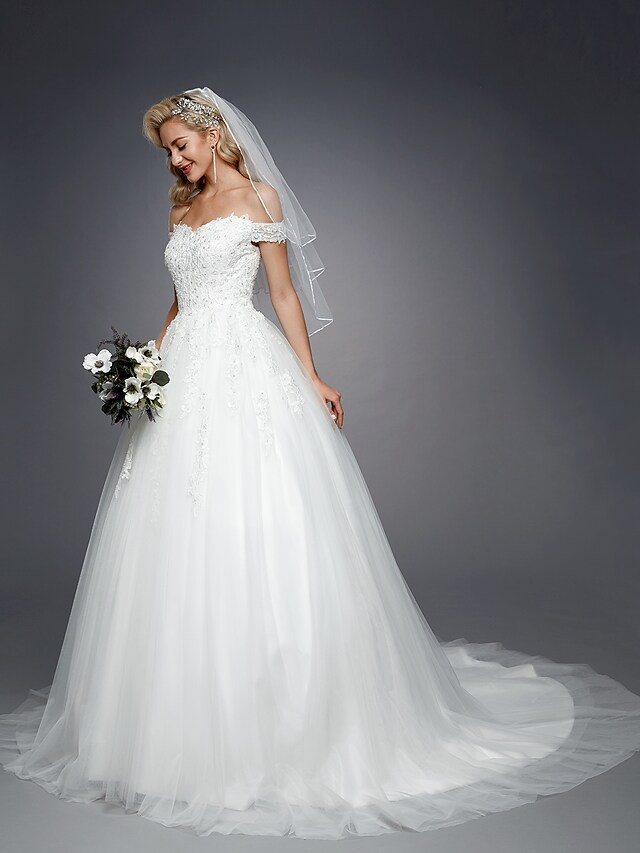 Detail of short sleeve and off-shoulder neckline on wedding dress.