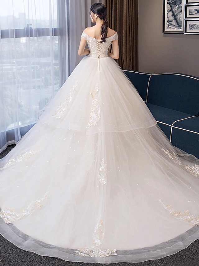 Close-up of crystal appliques on the organza wedding dress.