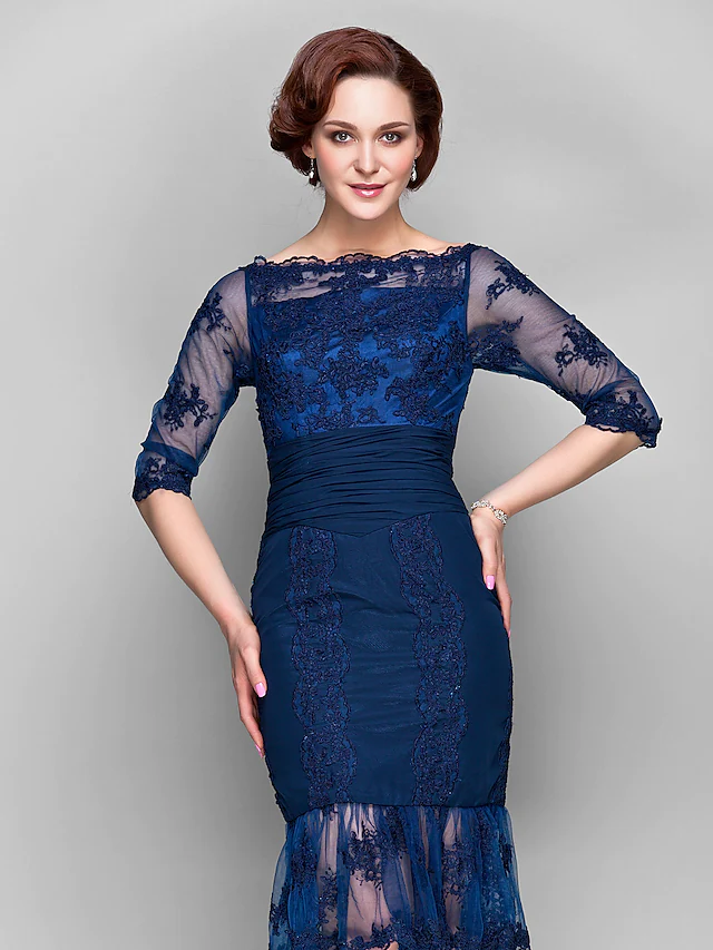 Close-up of the ruched appliques and half sleeve on the dress.