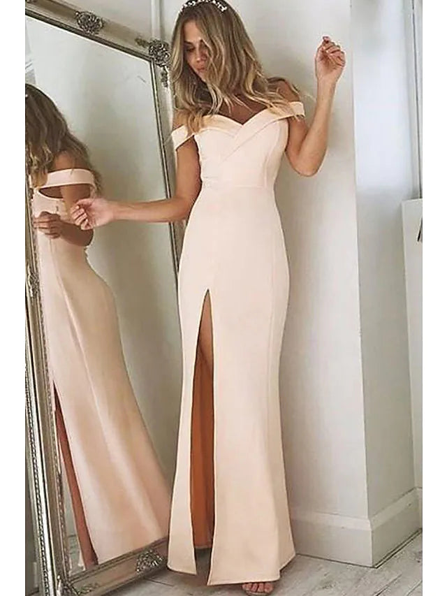 Model wearing an elegant off-shoulder mermaid trumpet prom dress.