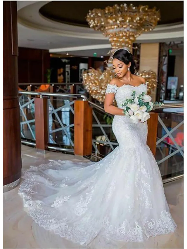 Elegant off-shoulder mermaid wedding dress with lace appliques and chapel train, front view.