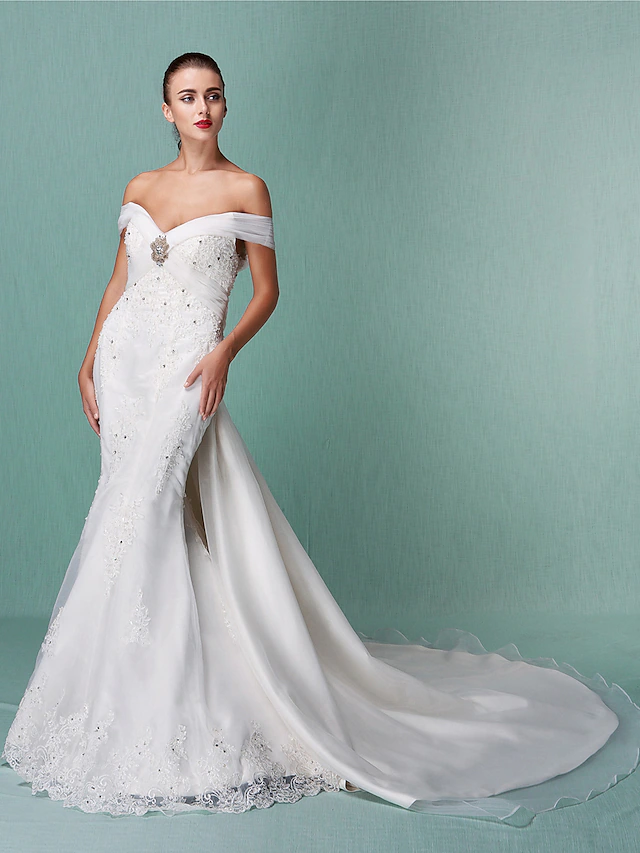 Elegant white off-shoulder organza wedding dress with beading appliques and chapel train.