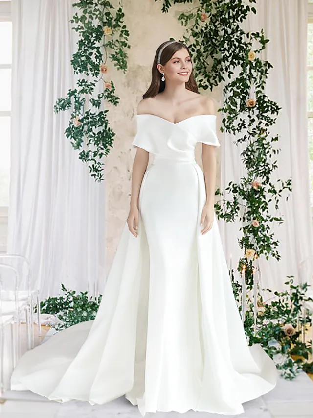 Model wearing an elegant off-shoulder satin wedding dress with short sleeves.