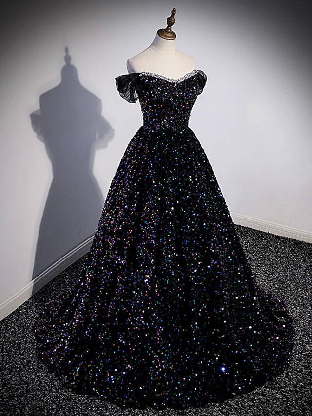 Close-up of the shimmering sequined fabric and delicate pleats on the ball gown.