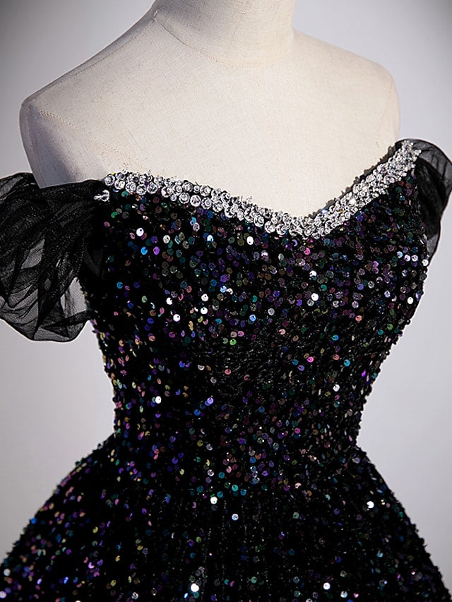 Back view of the off-shoulder ball gown, showcasing the flowing court train.