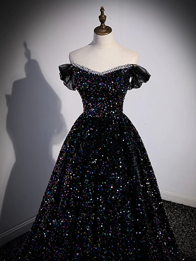 Side profile of the sequined ball gown, highlighting its majestic silhouette.