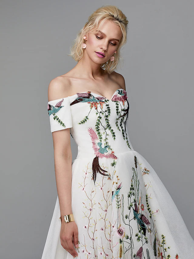 Back view of an embroidered off-shoulder ball gown with short sleeves.