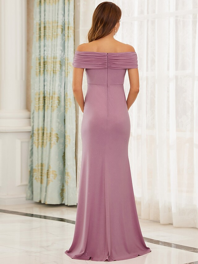 Side view of the floor-length off-shoulder satin gown.