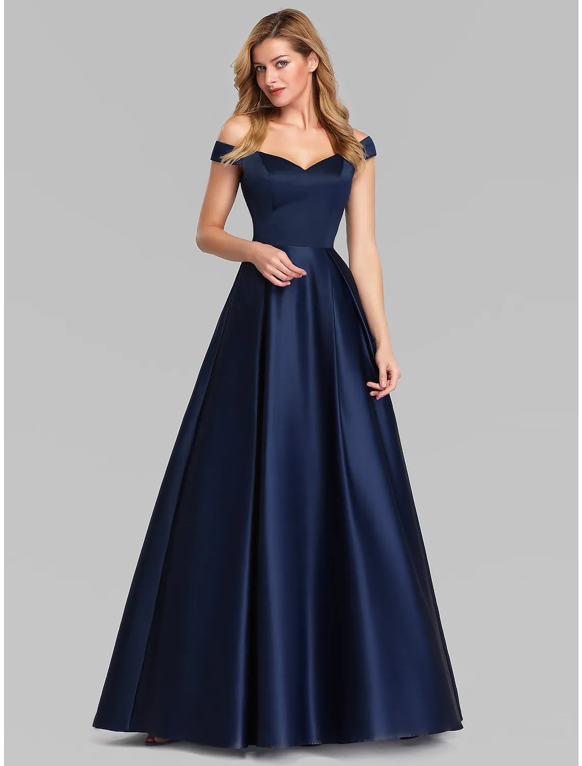 Side view of the model wearing the floor-length satin ball gown.