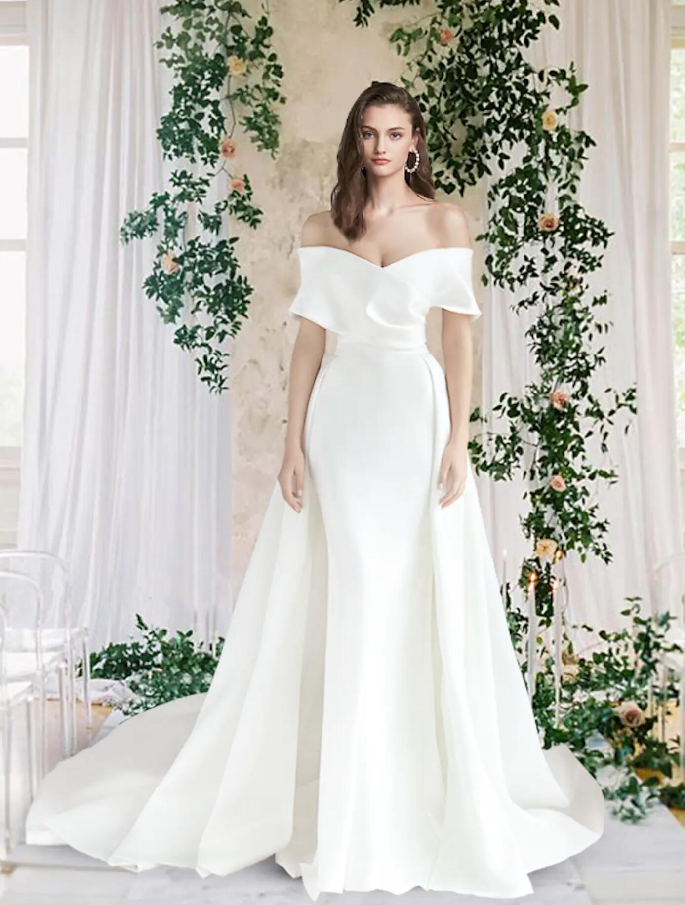 Elegant off-shoulder short sleeve satin wedding dress with ruched bodice.