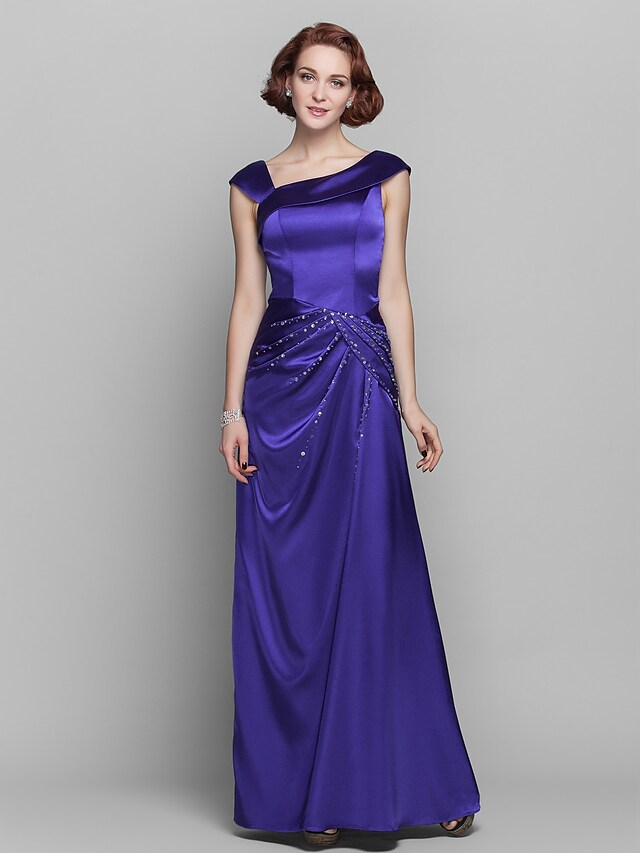 Elegant off-shoulder Mother of the Bride dress with beading and side draping.