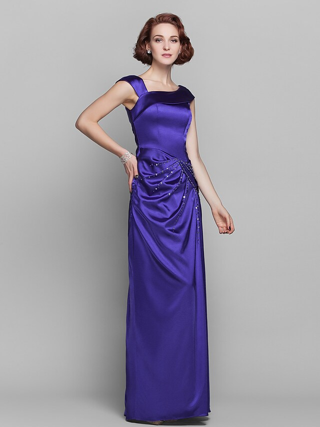 Elegant off-shoulder Mother of the Bride dress with beading and side draping.