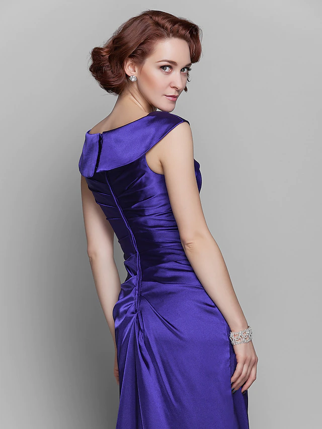 Elegant off-shoulder Mother of the Bride dress with beading and side draping.