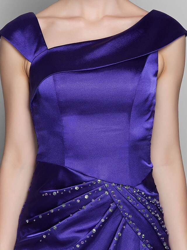 Elegant off-shoulder Mother of the Bride dress with beading and side draping.