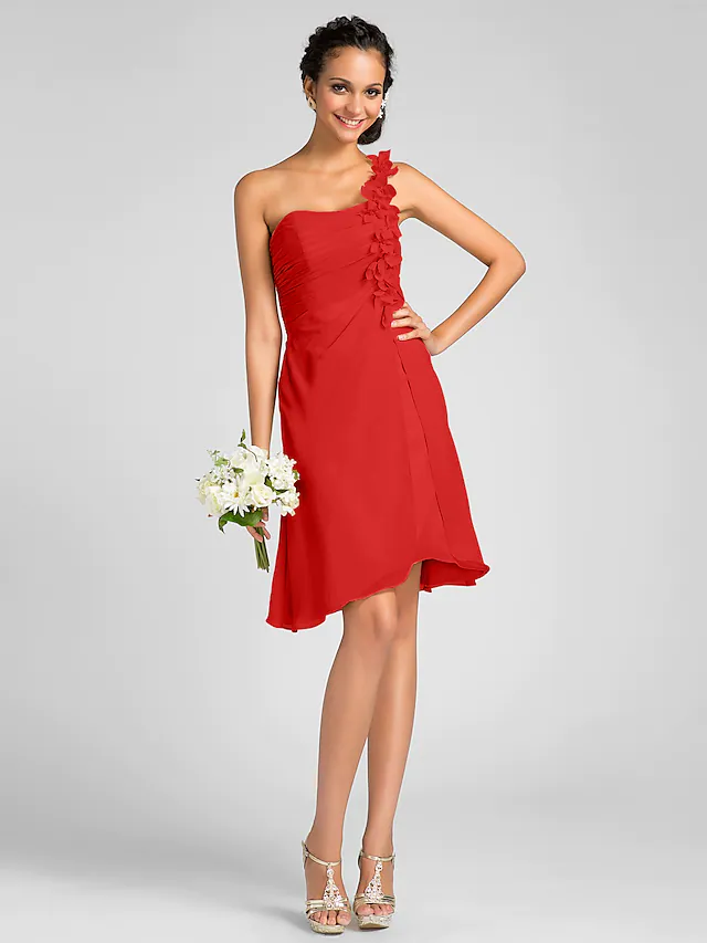 Close-up of the side draping and flower embellishment on the chiffon bridesmaid dress.
