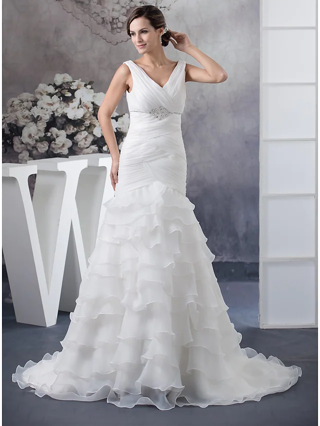 Elegant V-neck organza wedding dress with ruched bodice and chapel train.