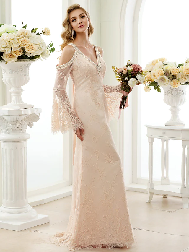 Close-up of sheer lace long sleeve on a white wedding dress.