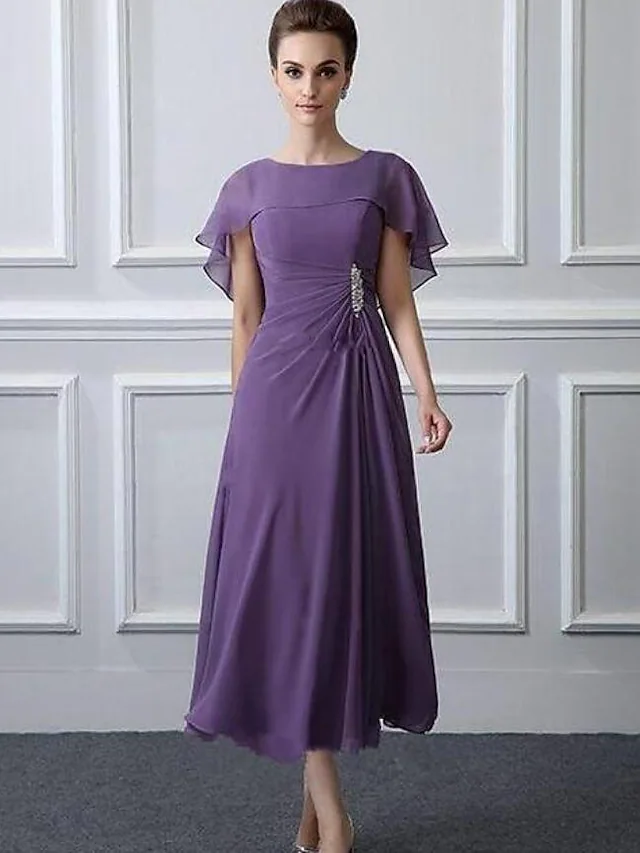 Elegant plus size A-line mother of the bride dress with bateau neck and tea length.