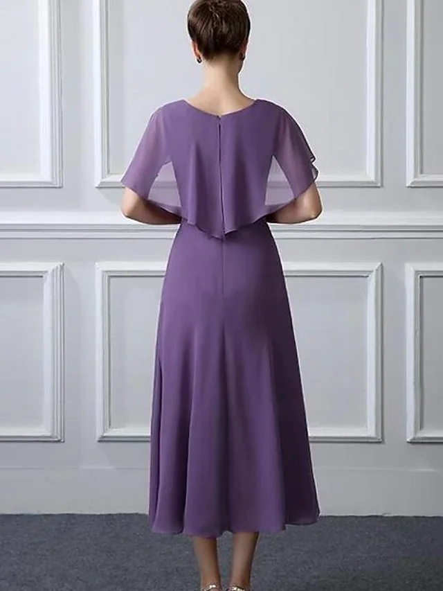 Back view of the tea-length mother of the bride dress with ruching.