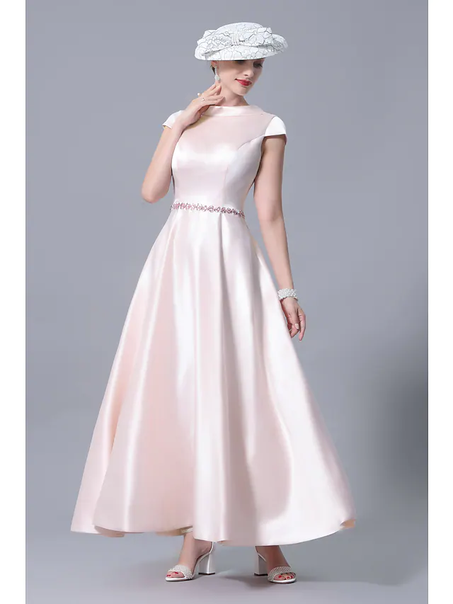 Side view of the satin A-Line dress with crystal details.
