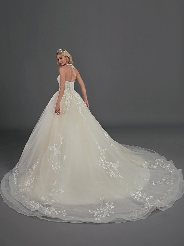 A-Line off-shoulder satin wedding dress with cascading ruffles and court train.