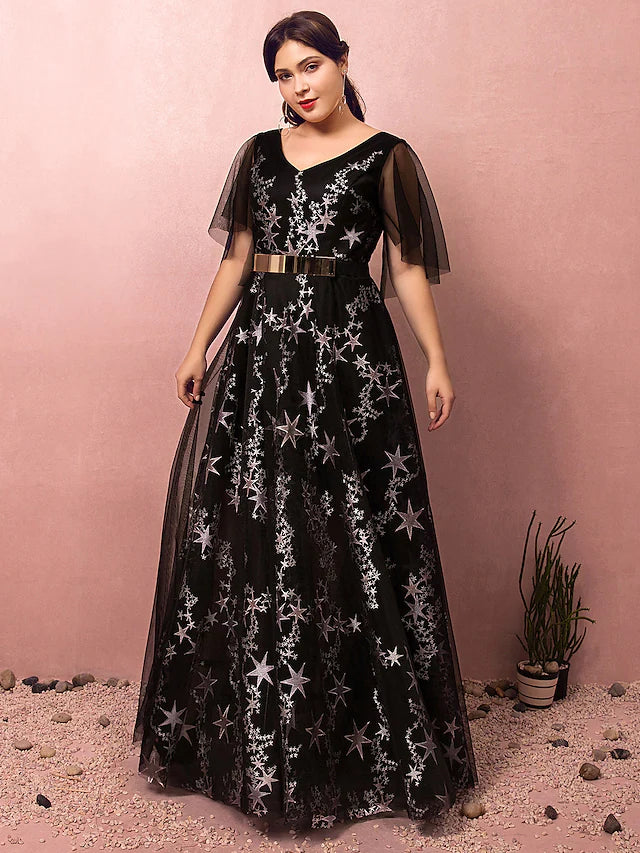 Back view of a plus size formal gown featuring a sash and pleated skirt.