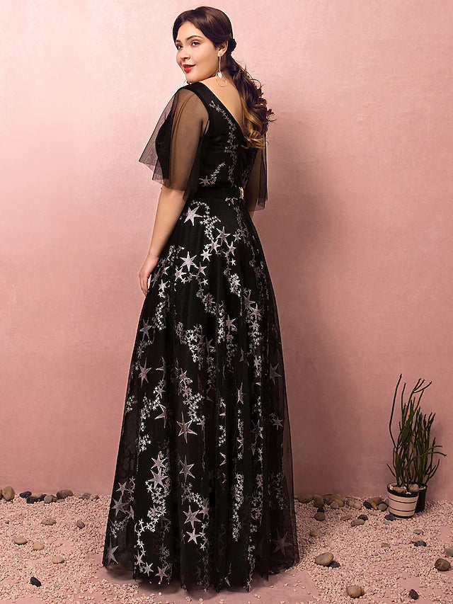Model wearing an elegant plus size prom dress with half sleeves and a flowing skirt.