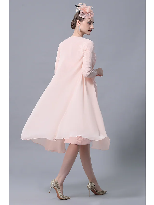 Side view of the plus size Mother of the Bride dress, showing knee-length and lace details.