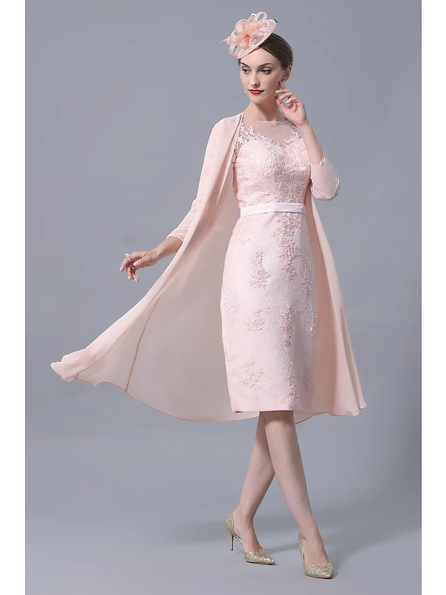 Close-up of the delicate lace and applique details on the dress sleeve.