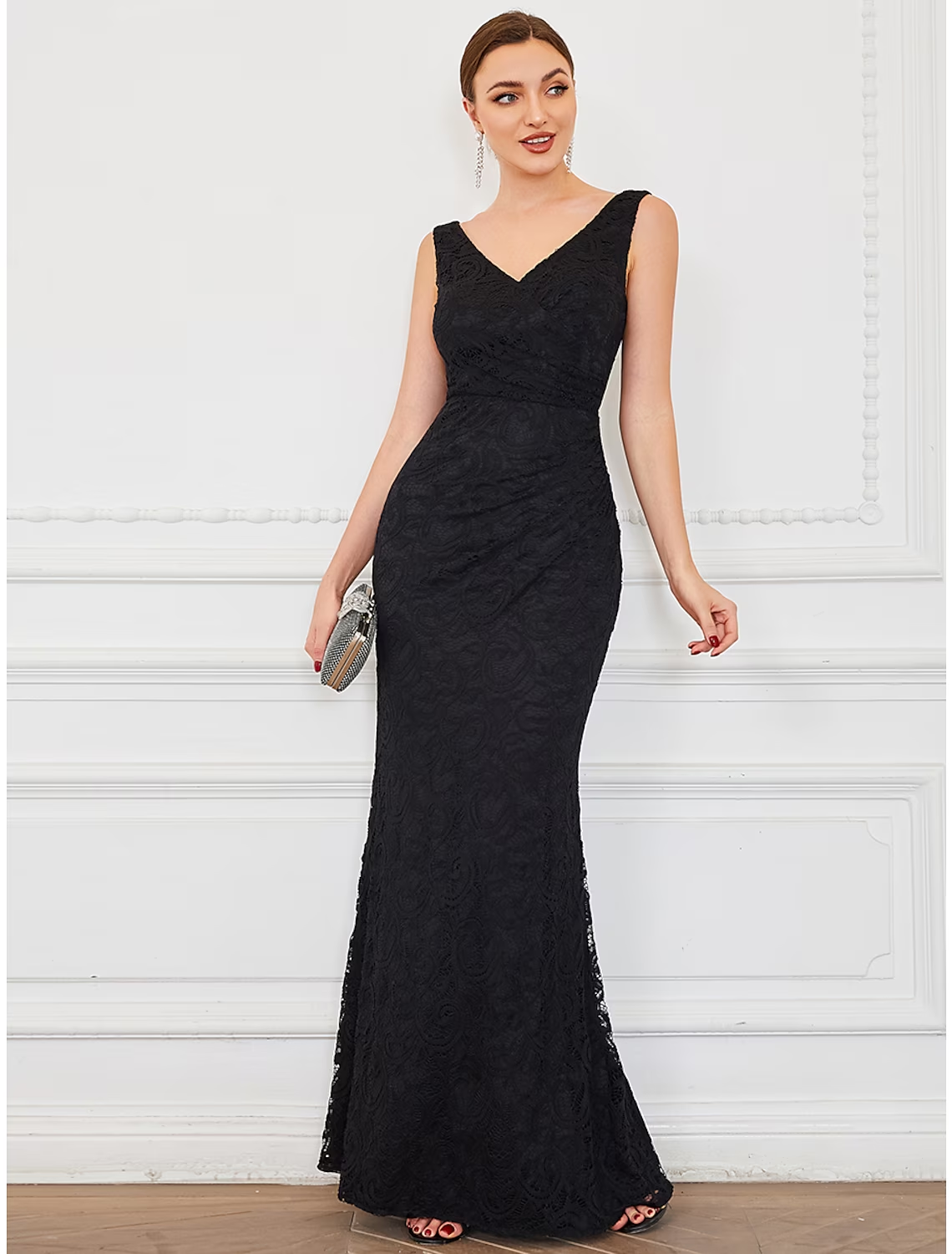 Plus size mermaid evening gown with V-neck and lace details.