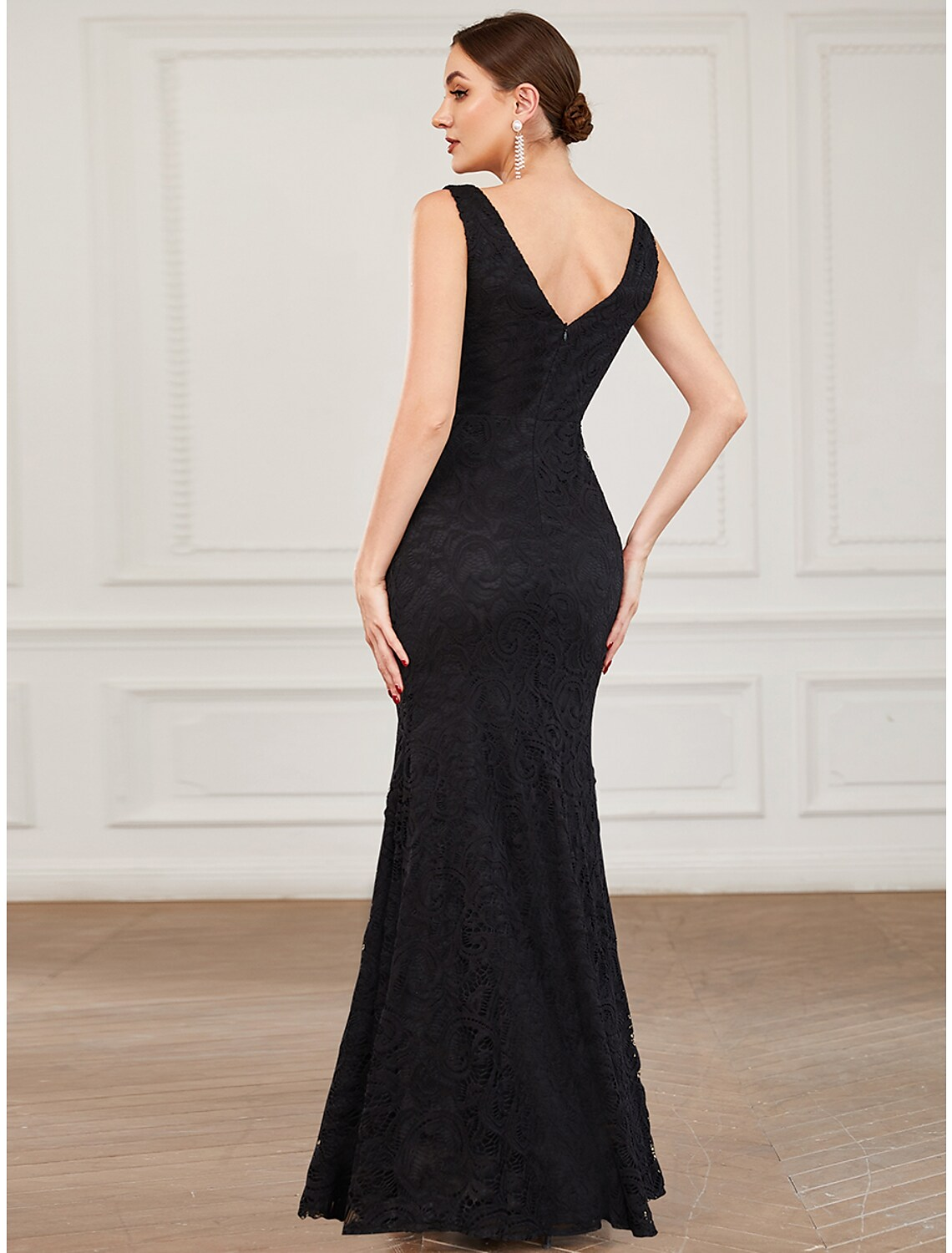 Side view of a plus size formal dress, showing the trumpet silhouette.