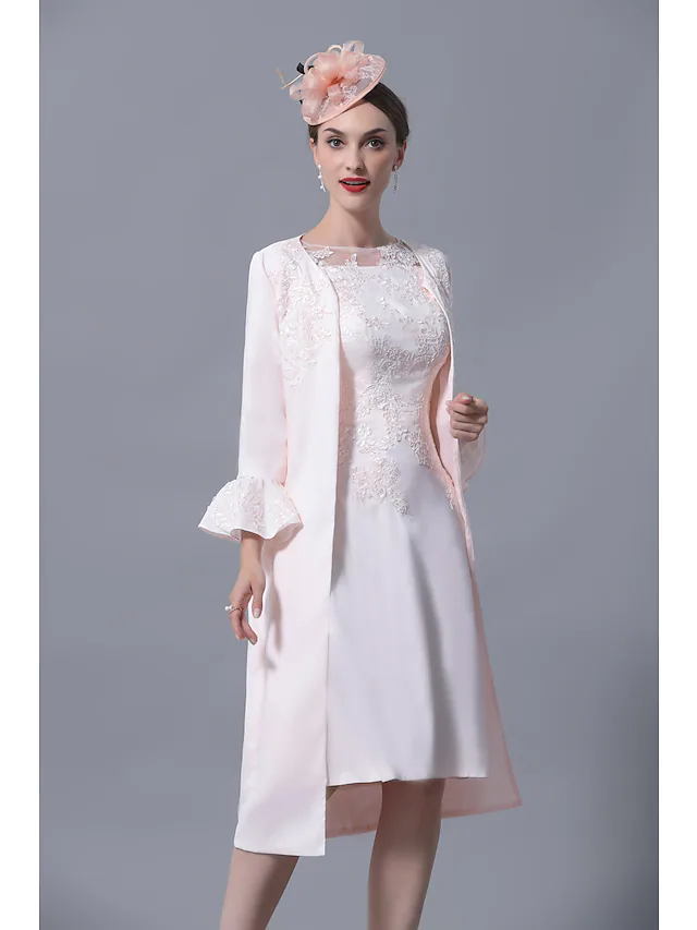 Elegant plus size Mother of the Bride dress with jewel neck and short sleeves.