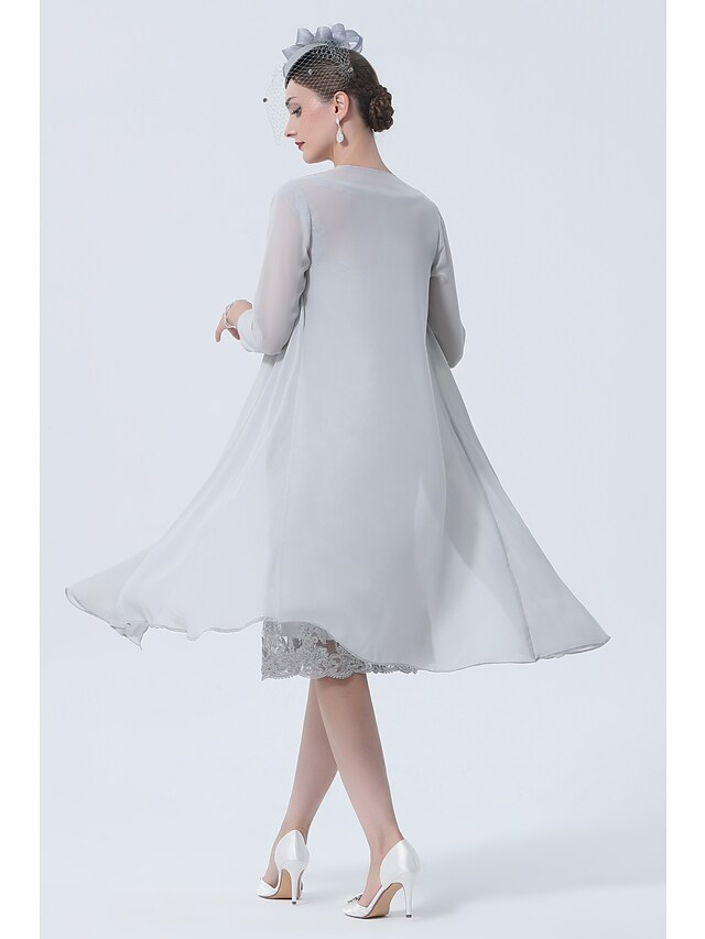 Side view of the tea length chiffon Mother of the Bride dress.