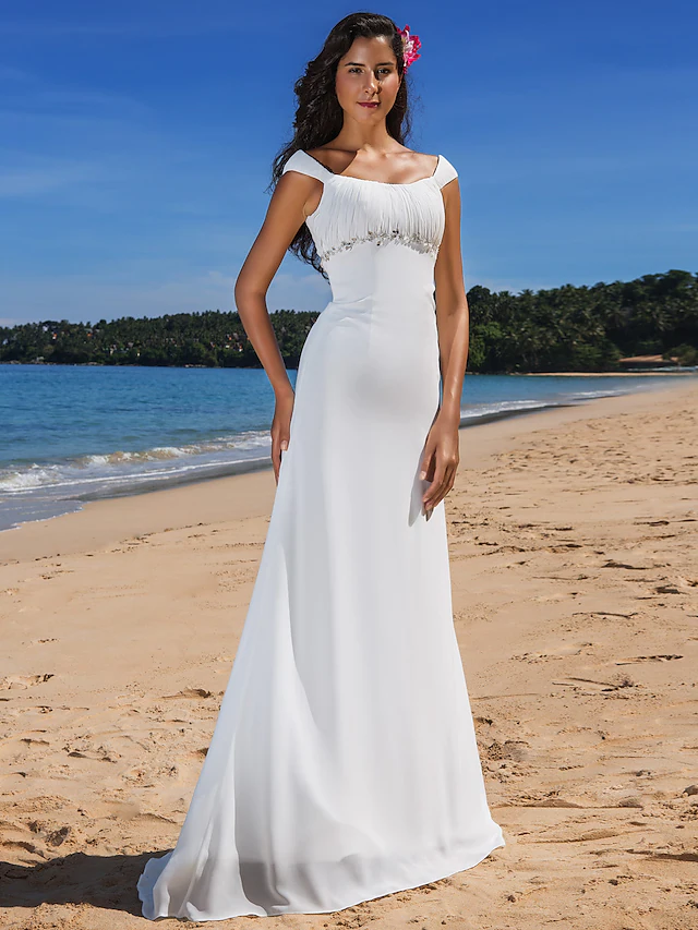 Elegant plus size wedding dress with scoop neck and cap sleeves.